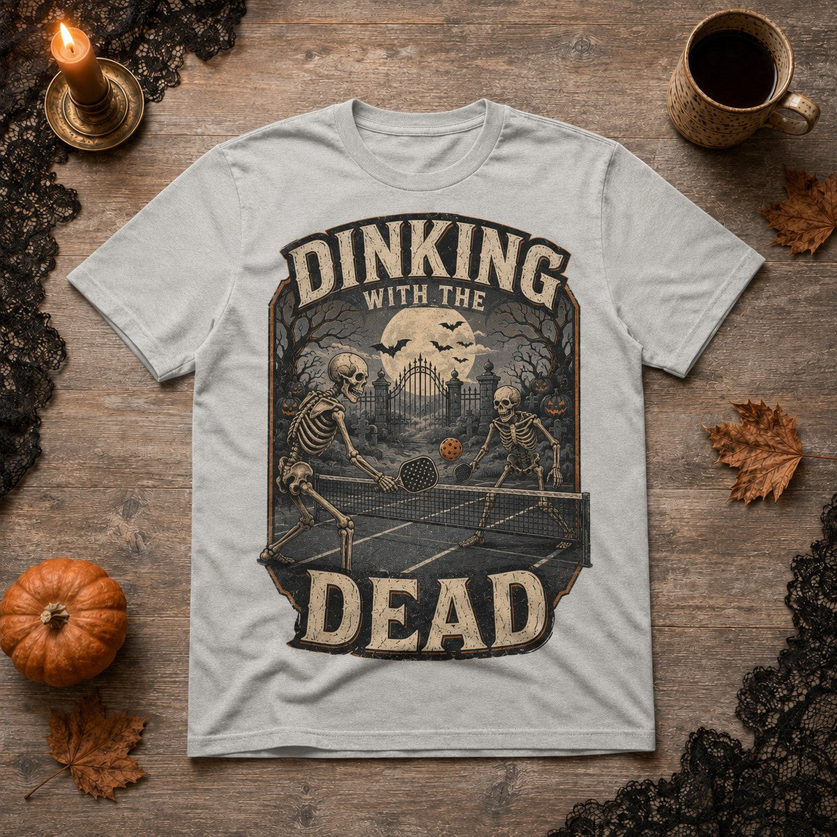 grey cotton t-shirt featuring a vintage skeleton pickleball graphic for Halloween.