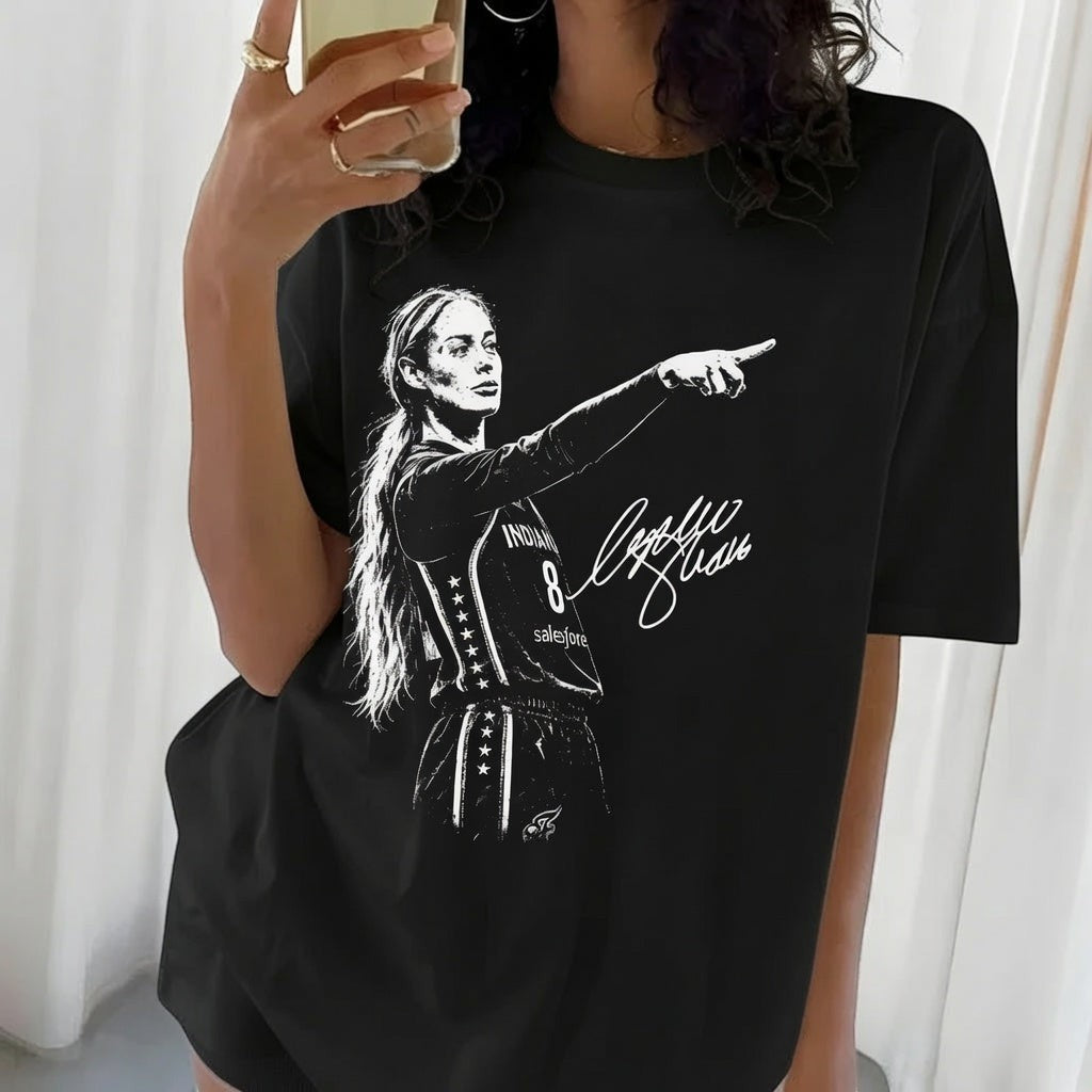  black cotton t-shirt featuring a white graphic of a female basketball player pointing with a signature
