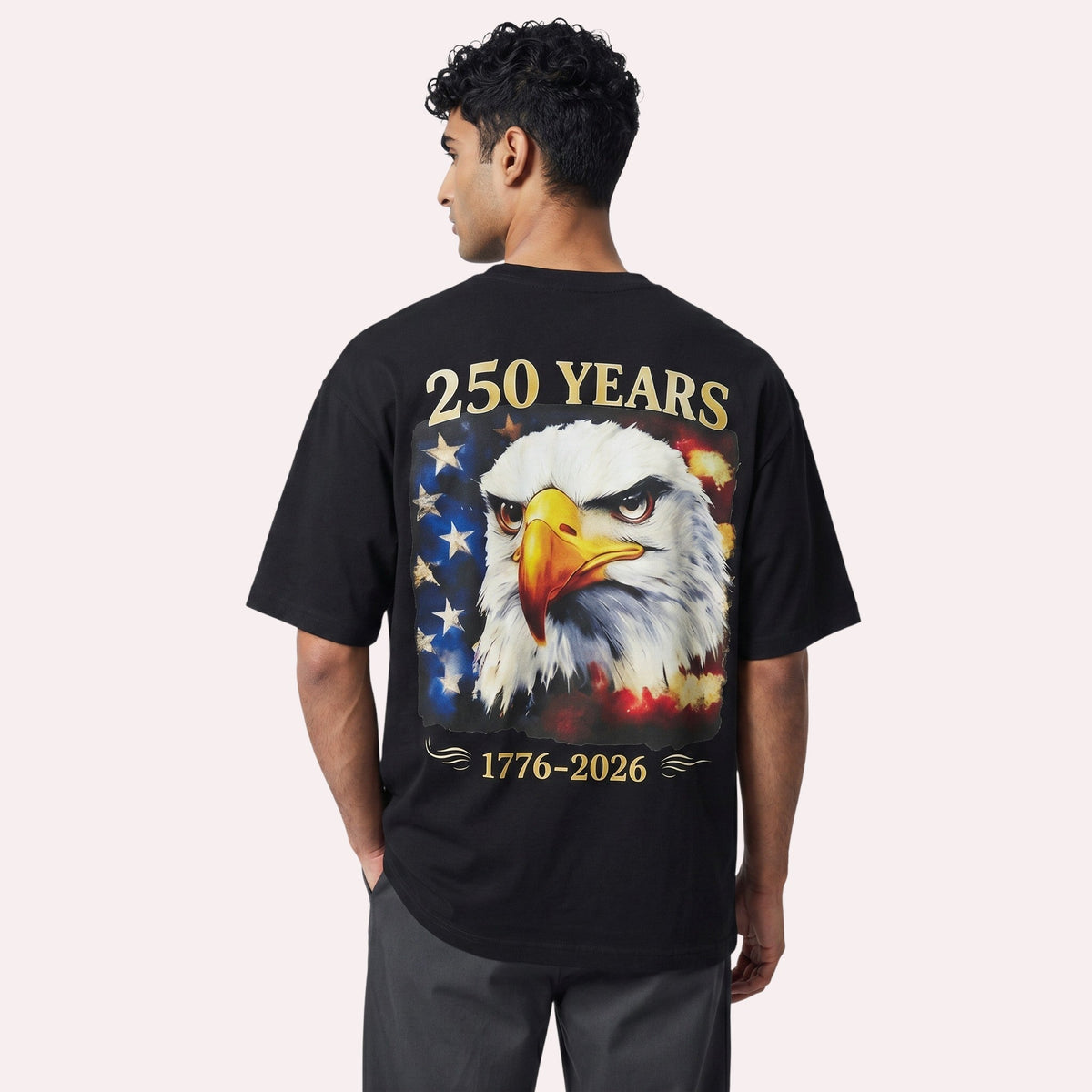  black cotton t-shirt with a large back graphic of a bald eagle and distressed American flag design.