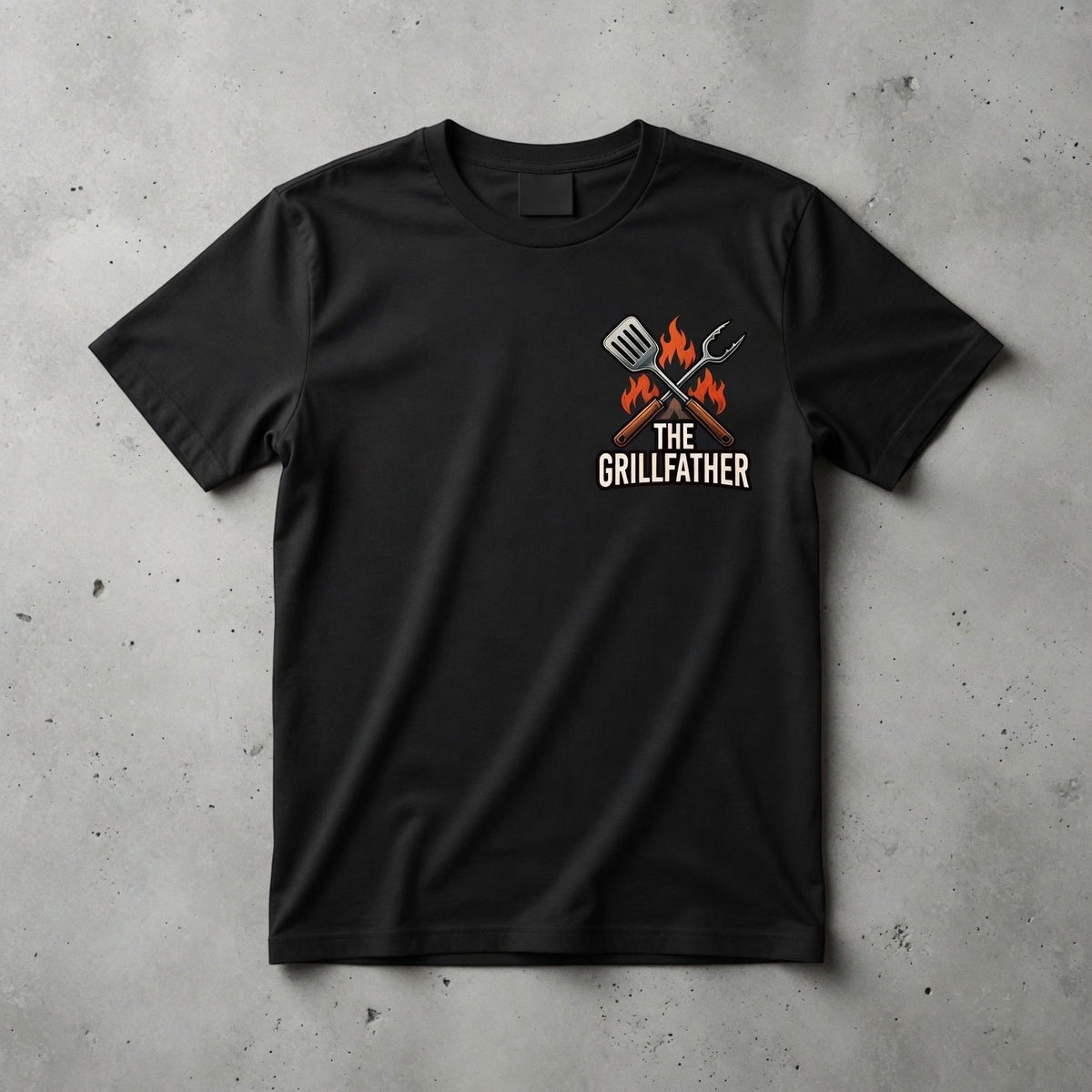  black cotton crew neck t-shirt featuring The Grillfather graphic with a spatula and tongs on the chest.