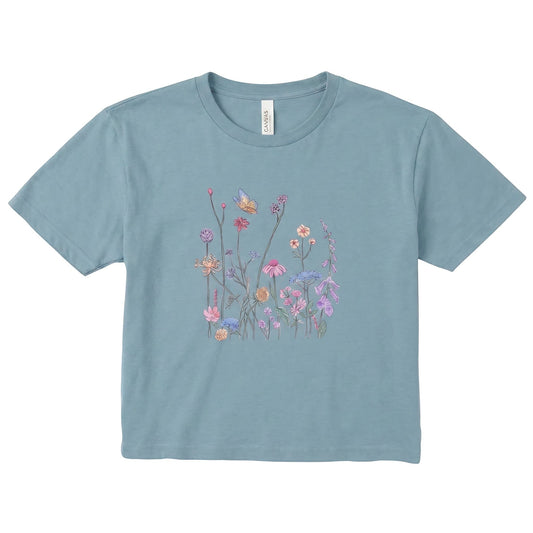  women's blue micro rib tee featuring a delicate colorful wildflower and butterfly graphic print.