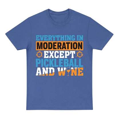  blue unisex cotton t-shirt featuring a graphic print about pickleball and wine in orange and blue.