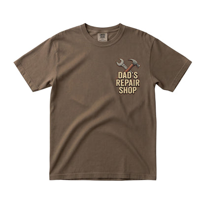  brown short sleeve crew neck t-shirt with Dad's Repair Shop hammer and wrench graphic on the chest