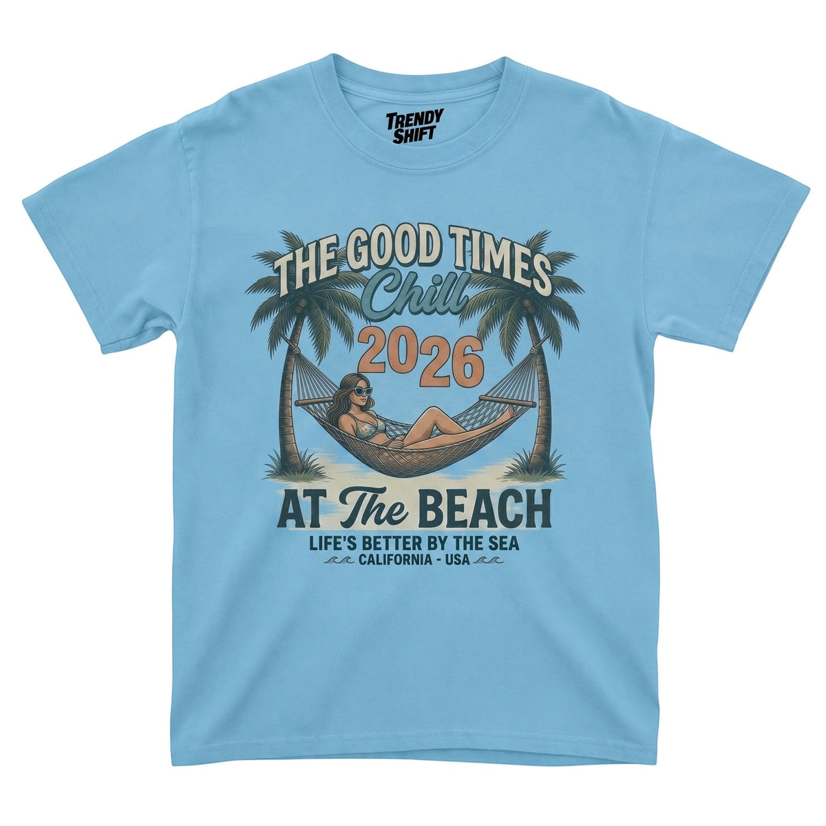  light blue graphic t-shirt featuring a retro beach scene with a woman in a hammock and palm trees.