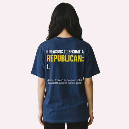 navy blue cotton graphic t-shirt with satirical political text on the back, worn by a woman.