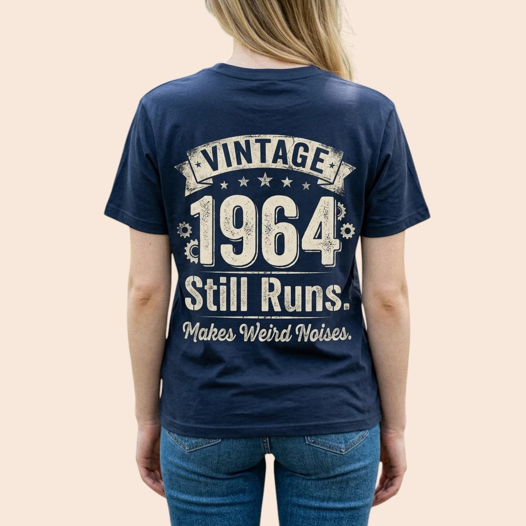  navy blue 100% cotton t-shirt with Vintage 1964 Still Runs Makes Weird Noises graphic on the back