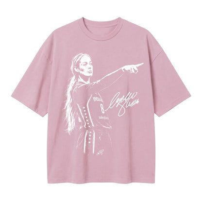  light pink oversized t-shirt featuring a white graphic print of a female basketball player pointing.
