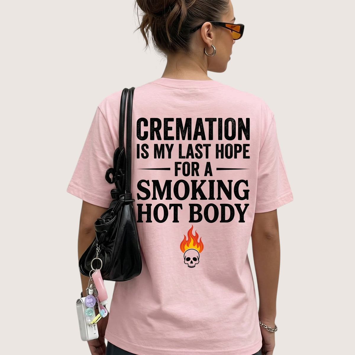  light pink unisex t-shirt with back graphic print featuring dark humor quote and skull flame icon