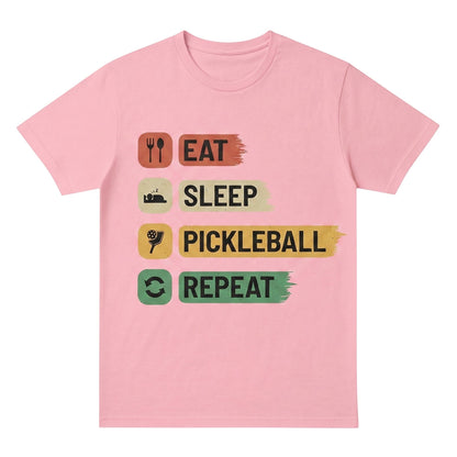  pink unisex cotton t-shirt featuring an Eat Sleep Pickleball Repeat graphic print on the front.