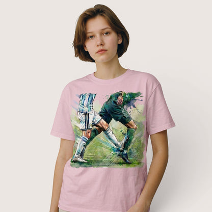  pink cotton t-shirt featuring a dynamic watercolor soccer duel graphic on a young woman