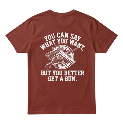  rust-colored cotton t-shirt featuring a white graphic print of firearms and bold text on the back.