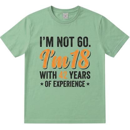  sage green cotton t-shirt with I’m not 60 I’m 18 with 42 years of experience vintage typography print