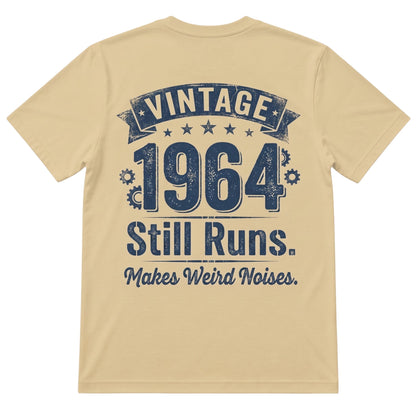  sand-colored 100% cotton t-shirt featuring a vintage 1964 Still Runs Makes Weird Noises graphic print.
