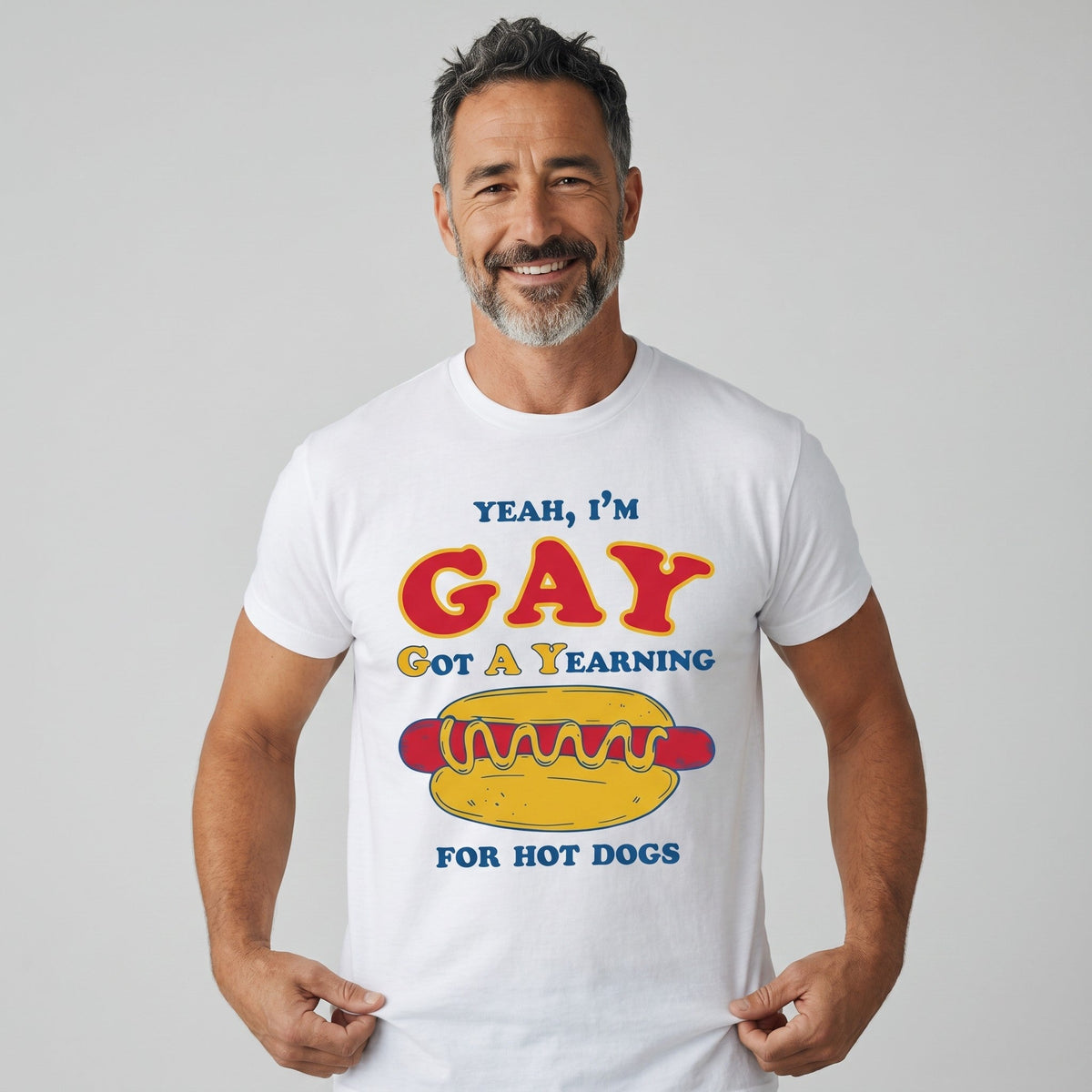  white cotton t-shirt with Yeah I'm GAY Got A Yearning for HOT DOGS graphic print on a smiling man