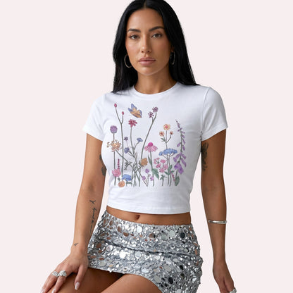  white micro rib crop tee featuring a colorful wildflower and butterfly graphic print.
