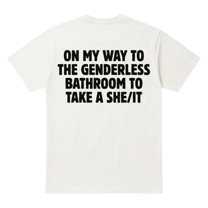  white cotton t-shirt with black text on the back reading On my way to the genderless bathroom to take a she/it.