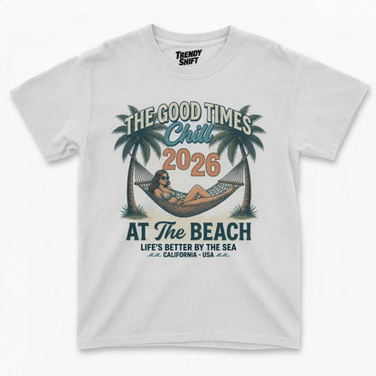  white graphic t-shirt featuring a retro beach scene with a woman in a hammock and palm trees.
