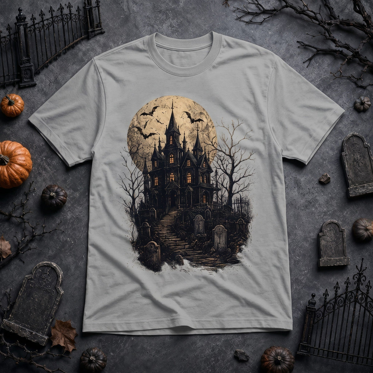  grey crew neck t-shirt featuring a spooky haunted house, full moon, and bats graphic print.