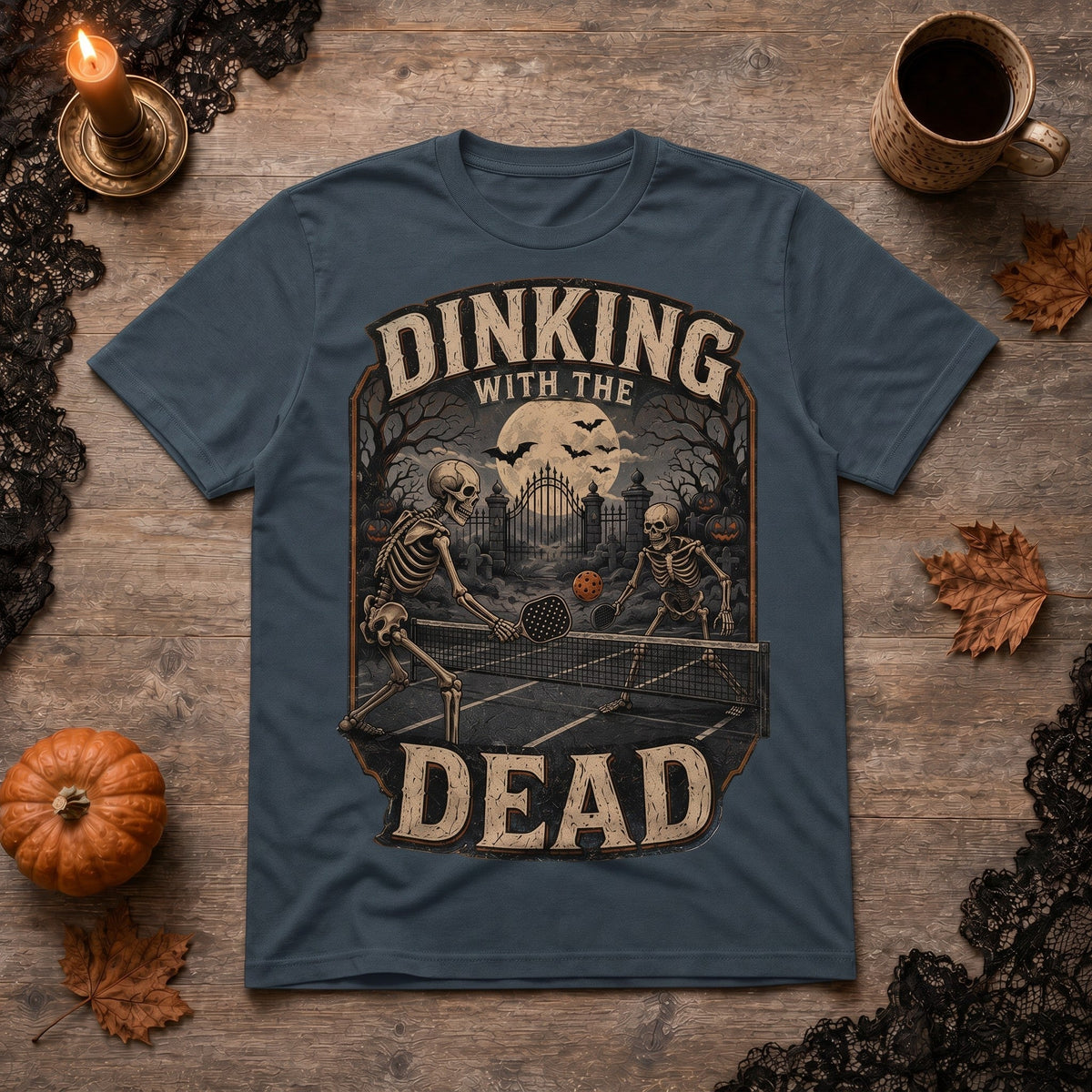  dark grey cotton t-shirt featuring a vintage skeleton pickleball graphic for Halloween.