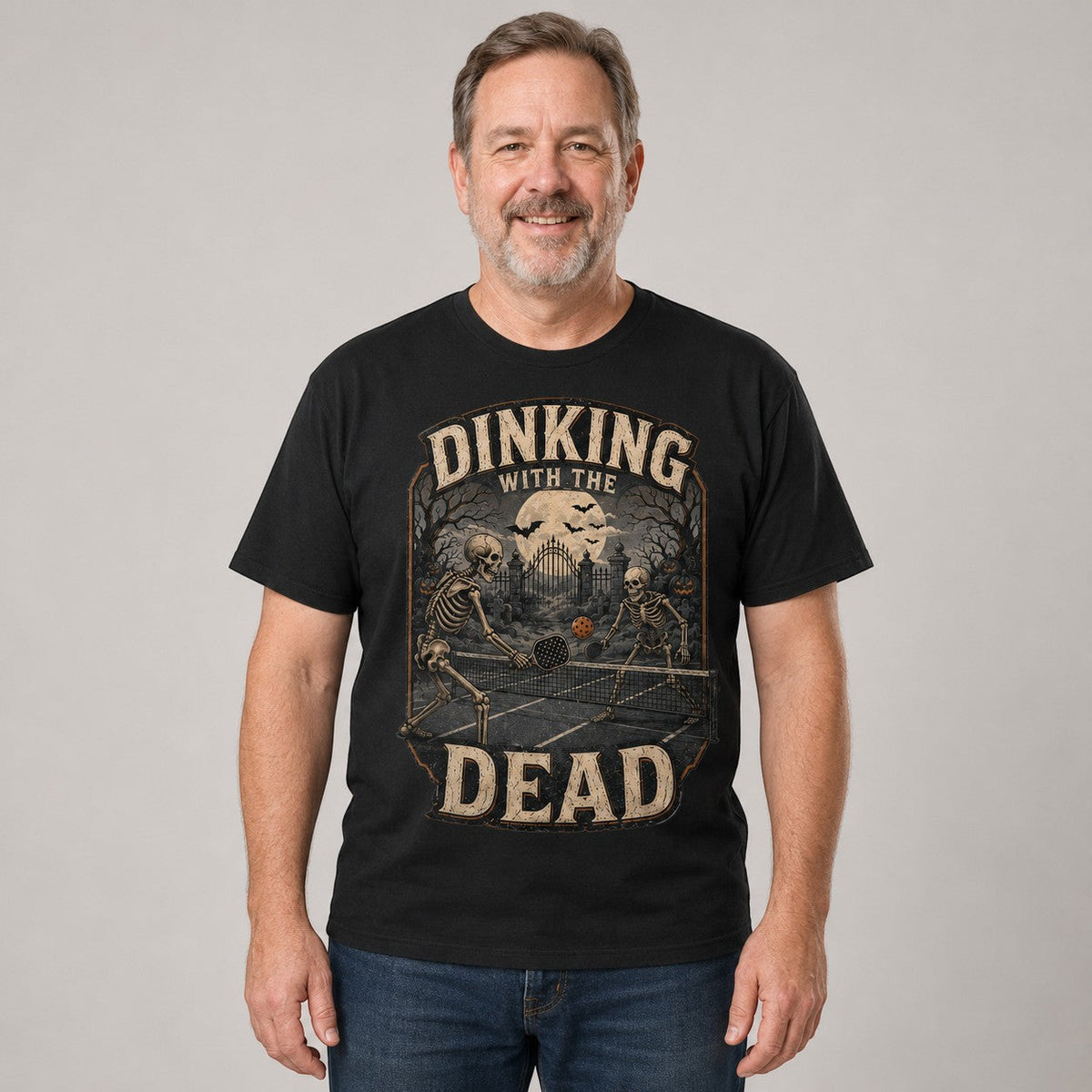  black cotton t-shirt featuring a vintage skeleton pickleball graphic for Halloween